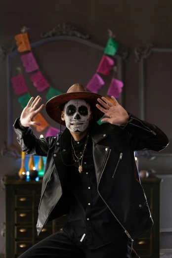 a man dressed as a skeleton poses for a picture, an album cover, pexels, sombrero, jordan peele's face, ( ( theatrical ) ), square