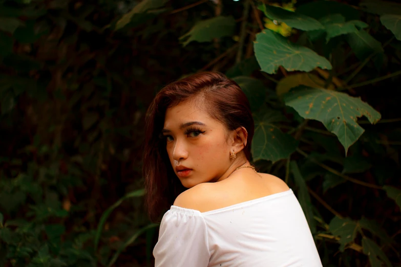 a woman in a white shirt posing for a picture, a picture, inspired by Elsa Bleda, trending on pexels, realism, malaysian, with ivy, young asian woman, bare shoulders