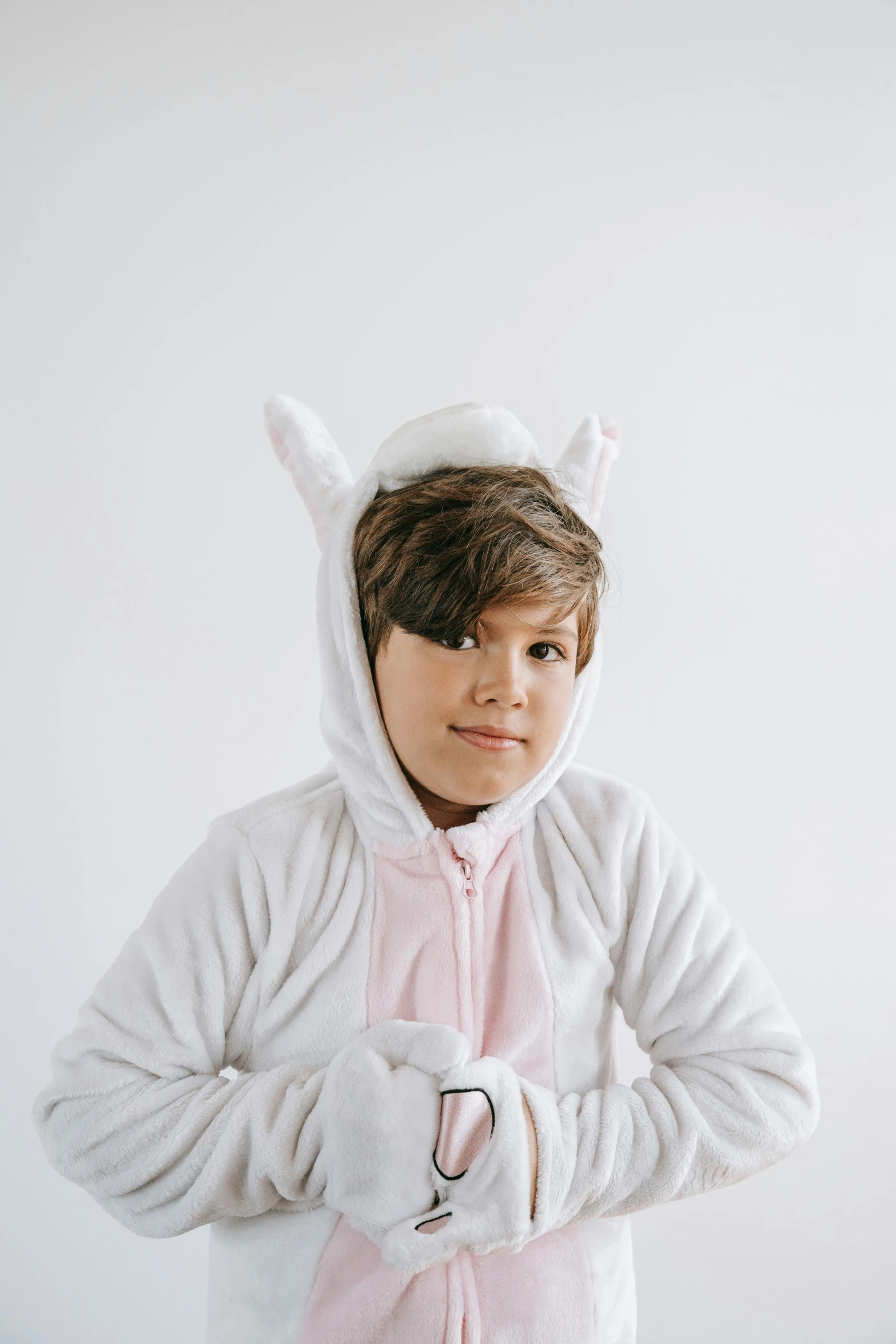 a young boy dressed in a bunny costume, inspired by Maurice Sendak, unsplash, white and pink, white ( cat ) girl, high quality photo