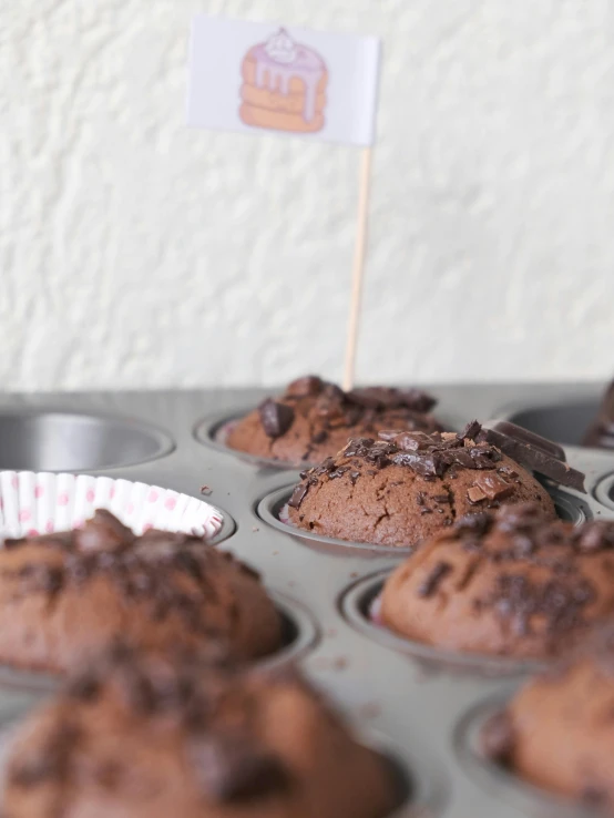 a muffin tin filled with chocolate muffins, unsplash, ilustration, kek, mini model, celebration