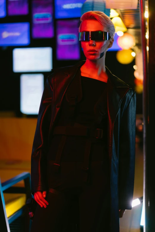 a man that is standing in front of a mirror, an album cover, inspired by Tadashi Nakayama, unsplash, bauhaus, all black cyberpunk clothes, cyberpunk 2 0 y. o model girl, leather robes, digital sunglasses