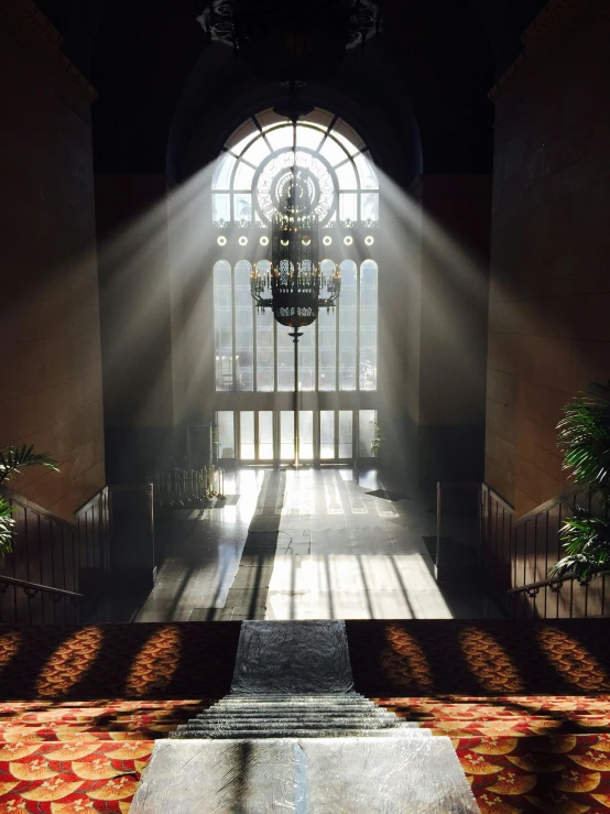 sunlight shines through a stained glass window in a church, a detailed matte painting, inspired by Sydney Prior Hall, unsplash contest winner, photography of gregory crewdson, taken in the late 2010s, inside a palace, cinematic. art deco