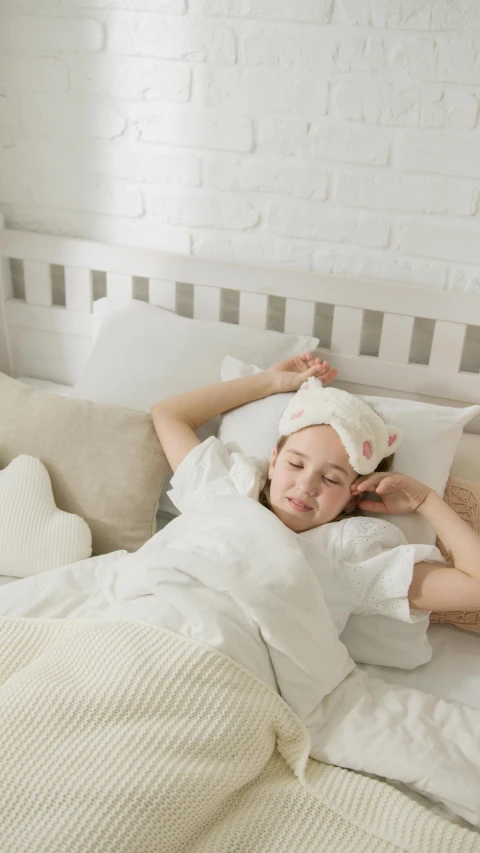 a woman laying in bed with a towel on her head, shutterstock, childs bedroom, jakarta, white ( cat ) girl, square