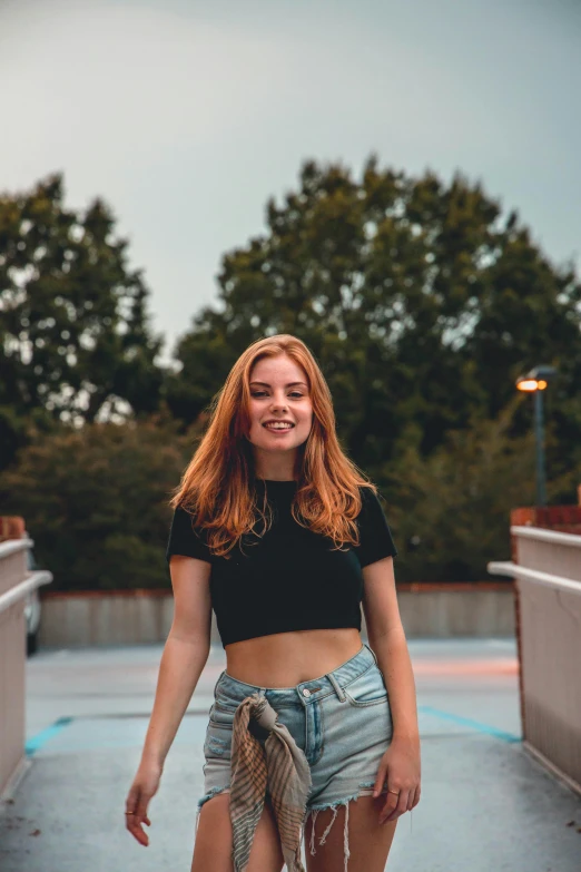 a beautiful young woman standing on top of a skateboard, pexels contest winner, renaissance, ginger hair with freckles, wearing a cropped black tank top, 15081959 21121991 01012000 4k, promotional image