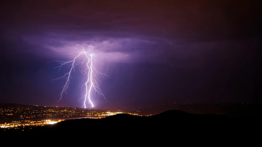 a lightning bolt in the sky over a city, pexels contest winner, renaissance, more thunderstorm, distant mountains lights photo, multiple stories, electrical signals