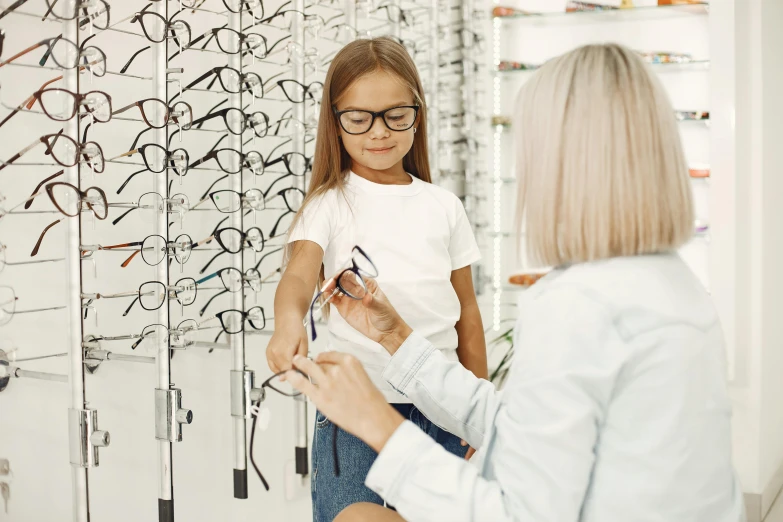 a woman and a little girl standing in front of a wall of glasses, trending on pexels, hurufiyya, local conspirologist, lachlan bailey, inspect in inventory image, orthoview