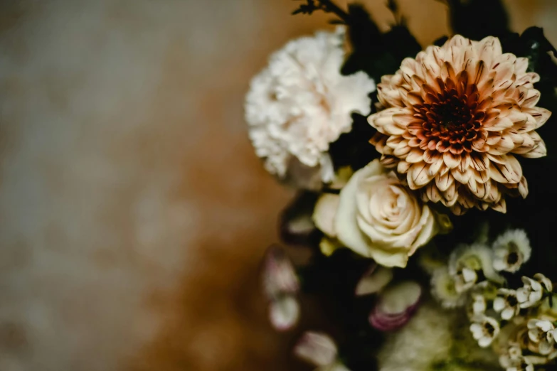 a bouquet of flowers sitting on top of a table, by Carey Morris, trending on unsplash, romanticism, brown colours, detail shot, high details photo, enhanced