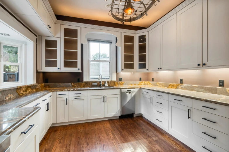 a kitchen with wooden floors and white cabinets, inspired by William Home Lizars, unsplash, private press, ornate with gold trimmings, commercial photography, youtube thumbnail, brown wood cabinets