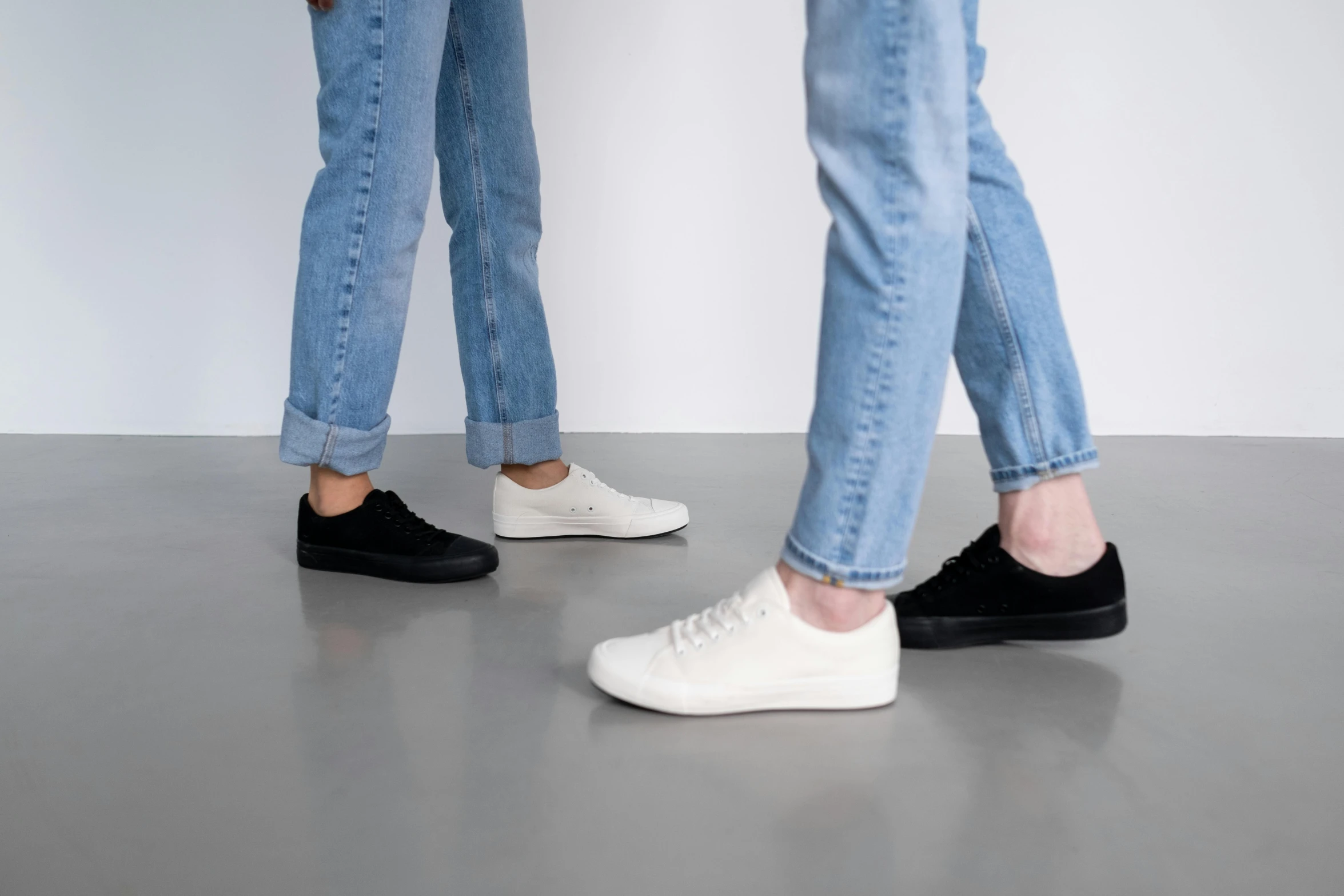 a couple of people standing next to each other, by Jonas De Ro, wearing white sneakers, vanta black, full product shot, denim