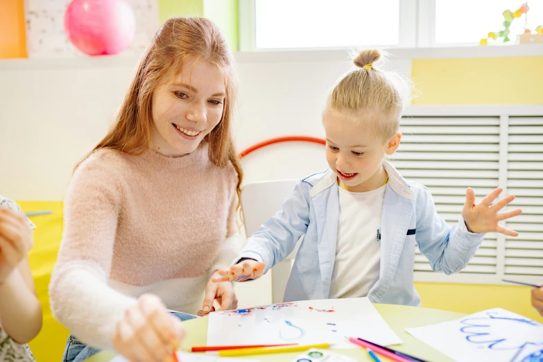 a woman and two children sitting at a table, a child's drawing, pexels contest winner, 15081959 21121991 01012000 4k, holding pencil, teacher, thumbnail