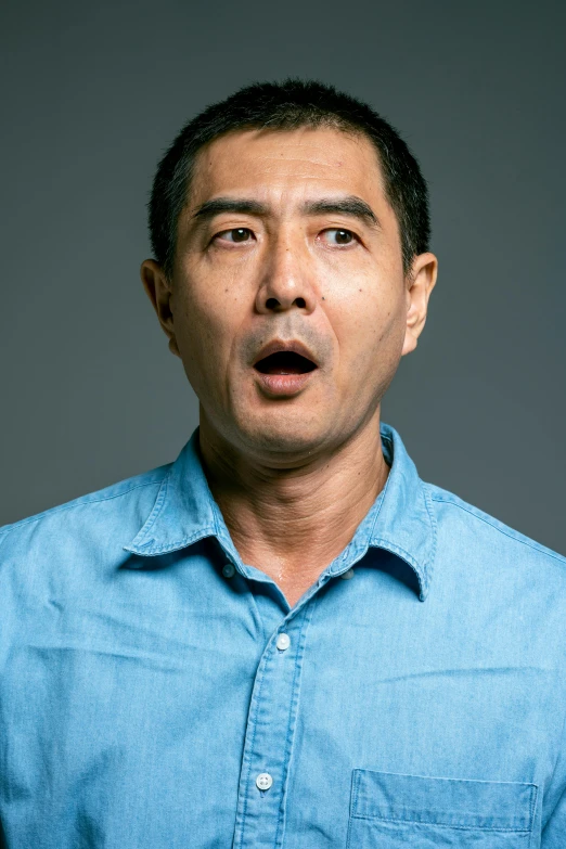 a man with a surprised look on his face, inspired by Xie Huan, instagram, standup comedian, head and shoulders shot, keng lye, middle aged man