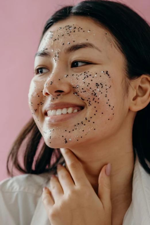 a woman with black spots on her face, trending on pexels, mingei, joy ang, pleasing face, speckled, korean