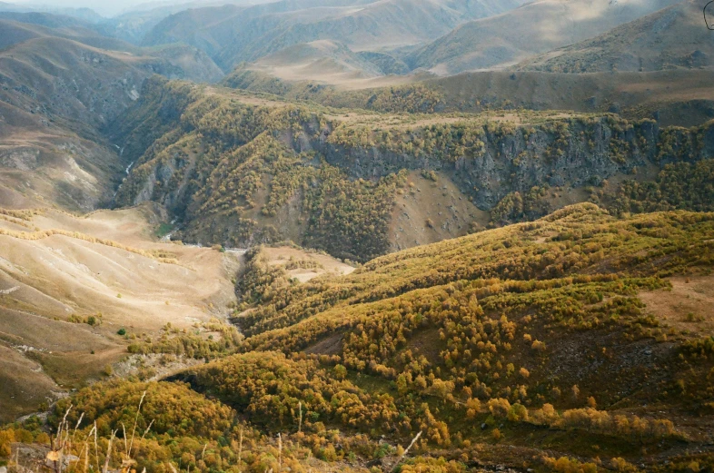 a view of the mountains from the top of a hill, by Muggur, pexels contest winner, les nabis, in between a gorge, southern slav features, autumnal, 2000s photo