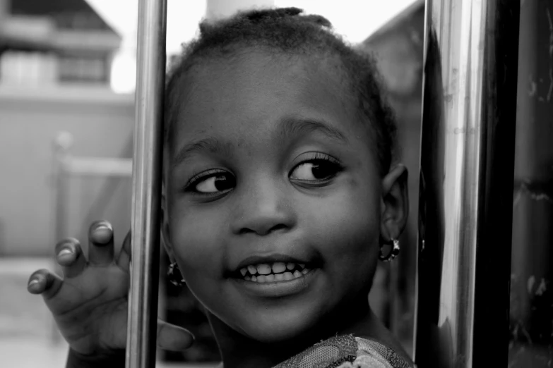 a black and white photo of a young girl, by Nadir Afonso, fun smile, more reflection, super cute funky black girl, looking outside