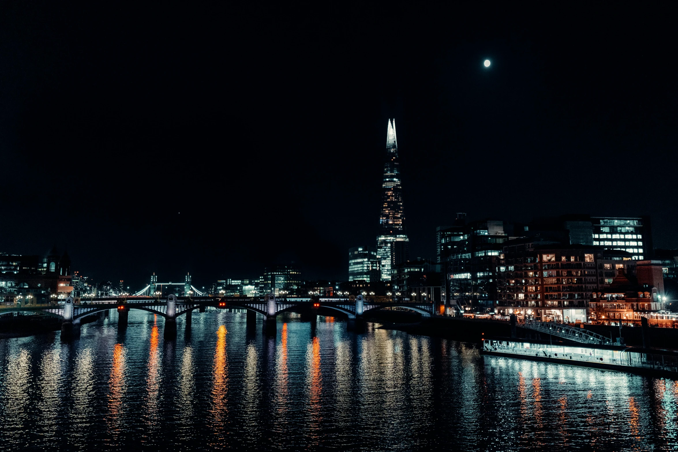 the london skyline at night with the shard of the shard of the shard of the shard of the shard of the sha, a photo, pexels contest winner, digital art, moon reflecting on the water, unsplash photo contest winner, tall bridge with city on top, light and dark