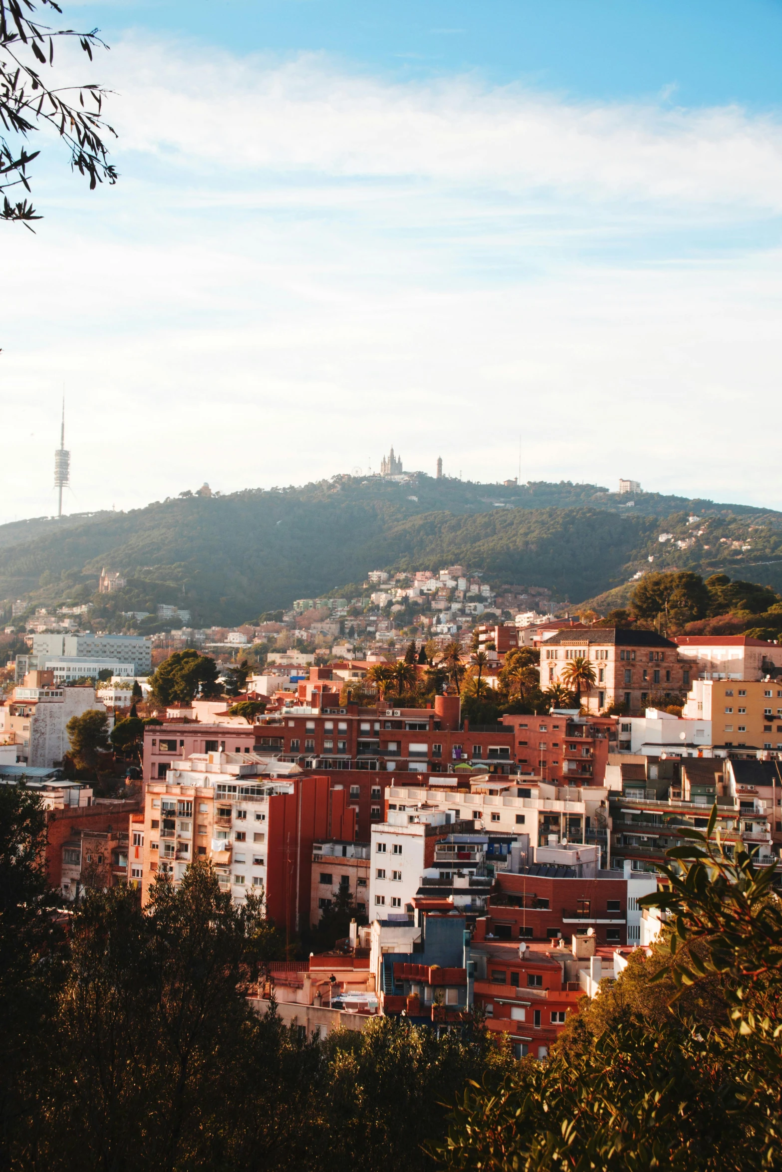 a view of a city from the top of a hill, in barcelona, slide show, fan favorite, sunfaded