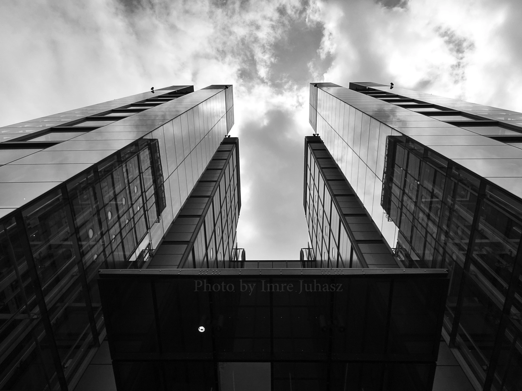 a black and white photo of a tall building, by Emma Andijewska, two towers, infinite sky, modern high sharpness photo, monochrome:-2