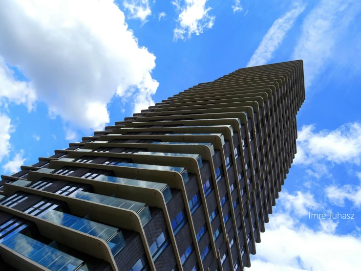 a very tall building with a lot of windows, inspired by Richard Wilson, unsplash, brutalism, low angle uhd 8 k, fan favorite, tall obsidian architecture, a 15 foot tall