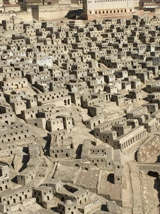 an aerial view of a city made out of bricks, cave town, massive scale, grey, from italica