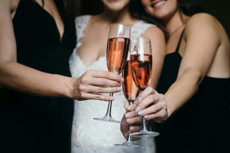 a group of women standing next to each other holding wine glasses, by Nicolette Macnamara, pexels, renaissance, bride, manuka, three views, pink