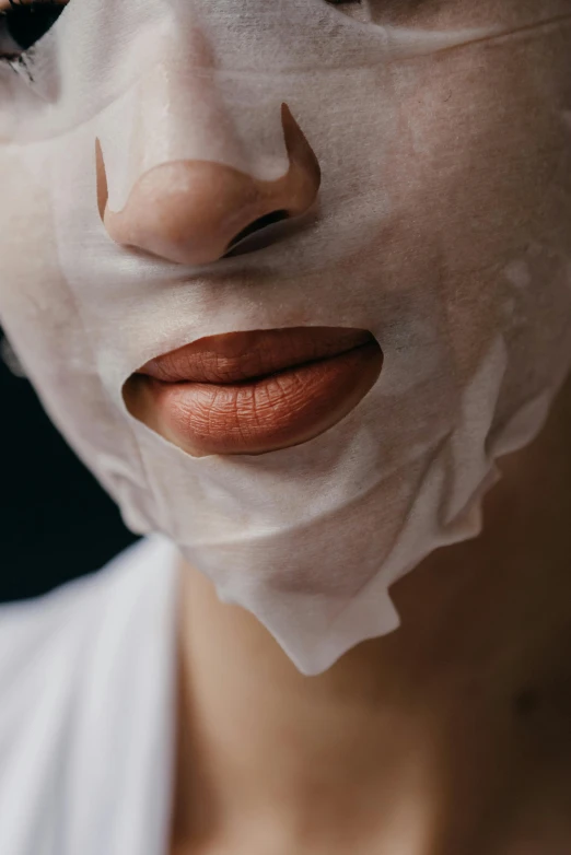 a woman with a sheet mask on her face, an album cover, trending on pexels, neck zoomed in from lips down, made of lab tissue, face macro shot, square face