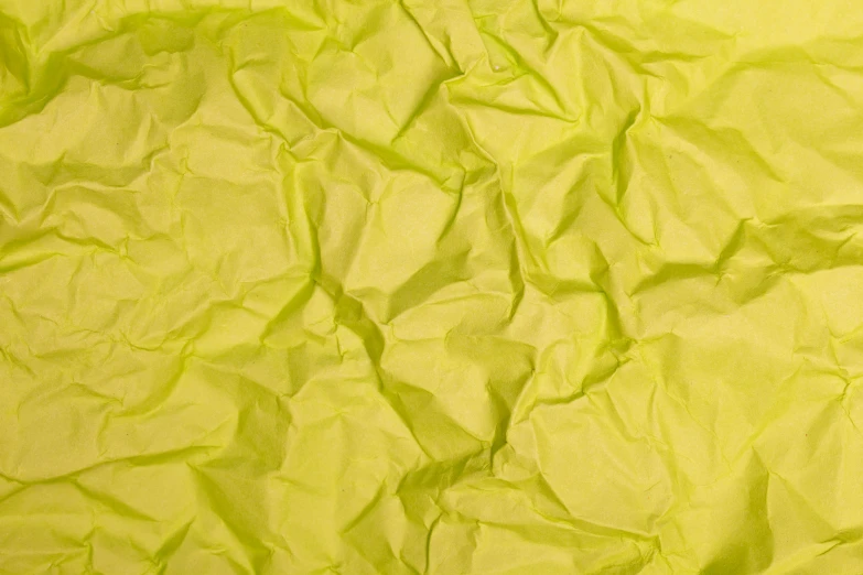a close up of a sheet of yellow paper, inspired by Christo, deviantart, light green, tissue paper art, detailed product image, luminescent fabrics