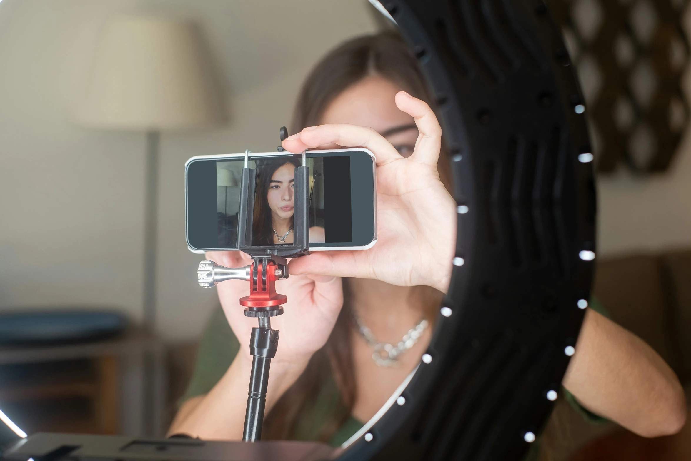 a woman taking a picture of herself in a mirror, ring light, tripod, avatar image, forward facing