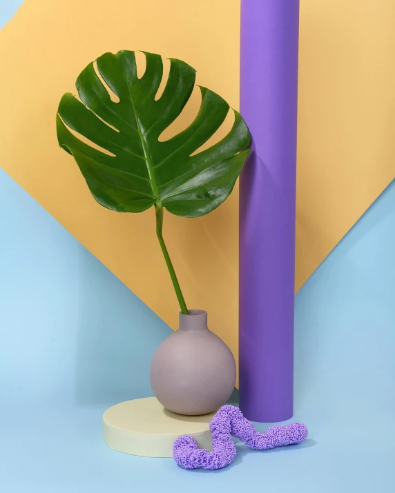 a purple vase sitting on top of a table next to a plant, inspired by Robert Mapplethorpe, muted rainbow tubing, monstera, 4 k product photo, modelling clay