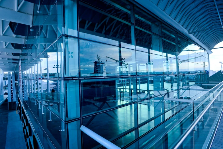 a view of the inside of an airport terminal, unsplash, modernism, blue reflections, outside large window of ship, avatar image, thumbnail