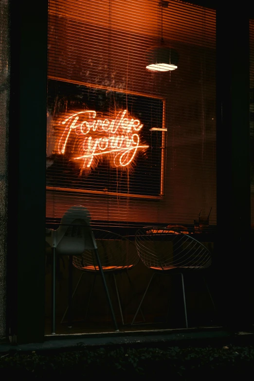 a neon sign in the window of a restaurant, trending on pexels, library of forever, black and terracotta, young, yor forger