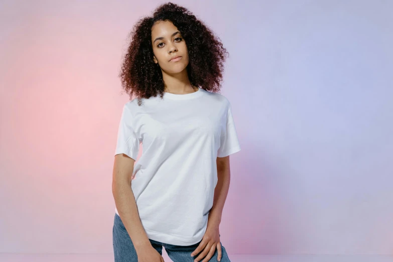 a woman wearing a white t - shirt and jeans, trending on pexels, pastel faded effect, mixed-race woman, pearlescent white, full colour