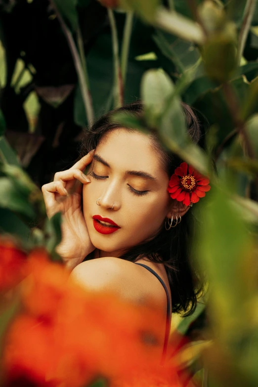 a woman with a red flower in her hair, inspired by Kahlo, trending on pexels, lush foliage, kiko mizuhara, bali, editorial image