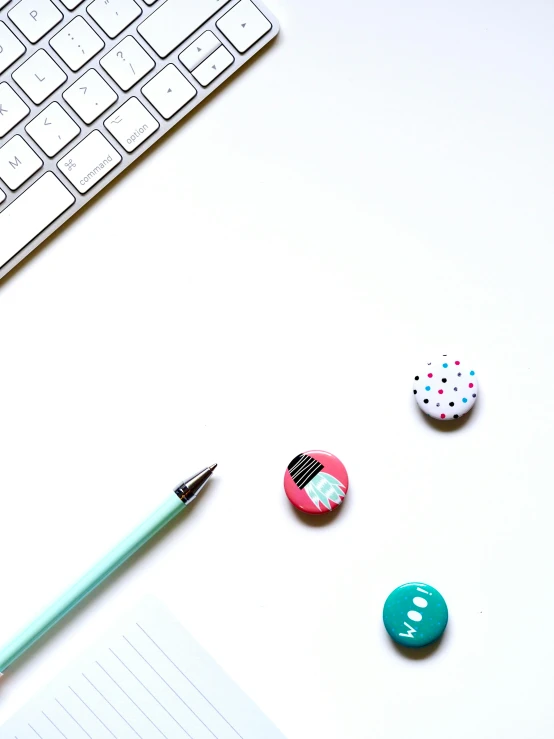 a computer keyboard sitting on top of a white desk, by Arabella Rankin, unsplash, visual art, 9 9 designs, polka dot, teal, miscellaneous objects