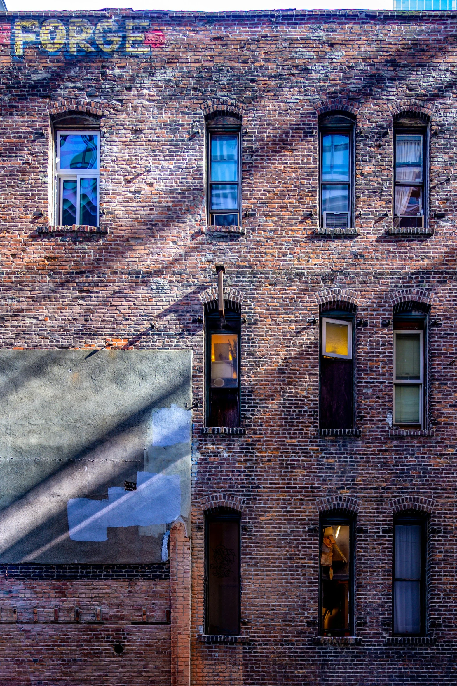 a red fire hydrant sitting in front of a brick building, an album cover, pexels contest winner, modernism, view from window, louis sullivan, archviz, wide high angle view