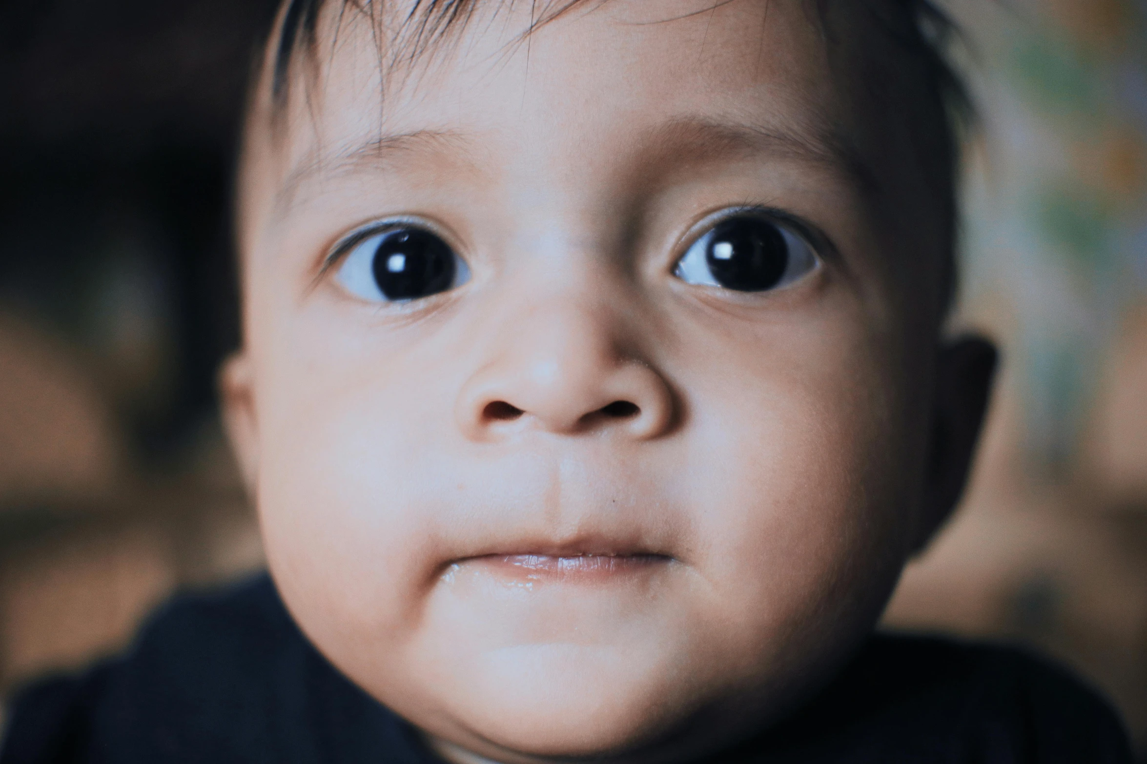 a close up of a baby wearing a tie, pexels contest winner, hyperrealism, huge bulbous pitch black eyes, south east asian with round face, a handsome