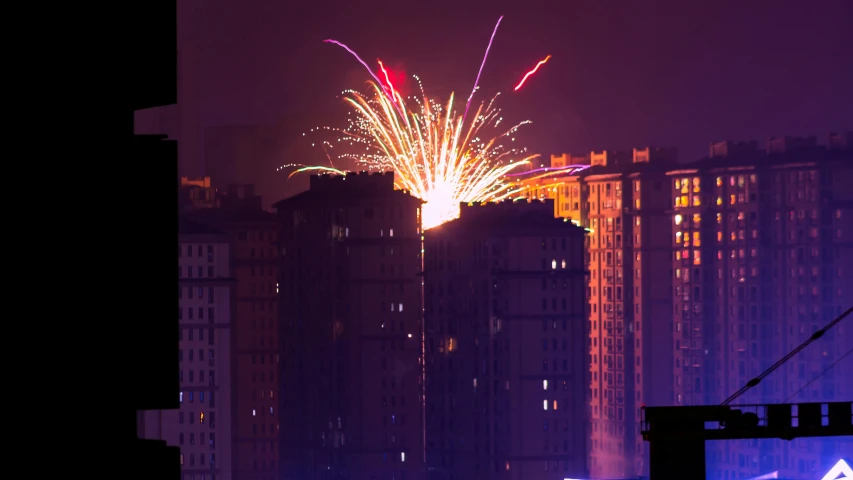 fireworks in the sky over a city at night, a photo, by Attila Meszlenyi, soviet apartment building, getty images, flare, 15081959 21121991 01012000 4k