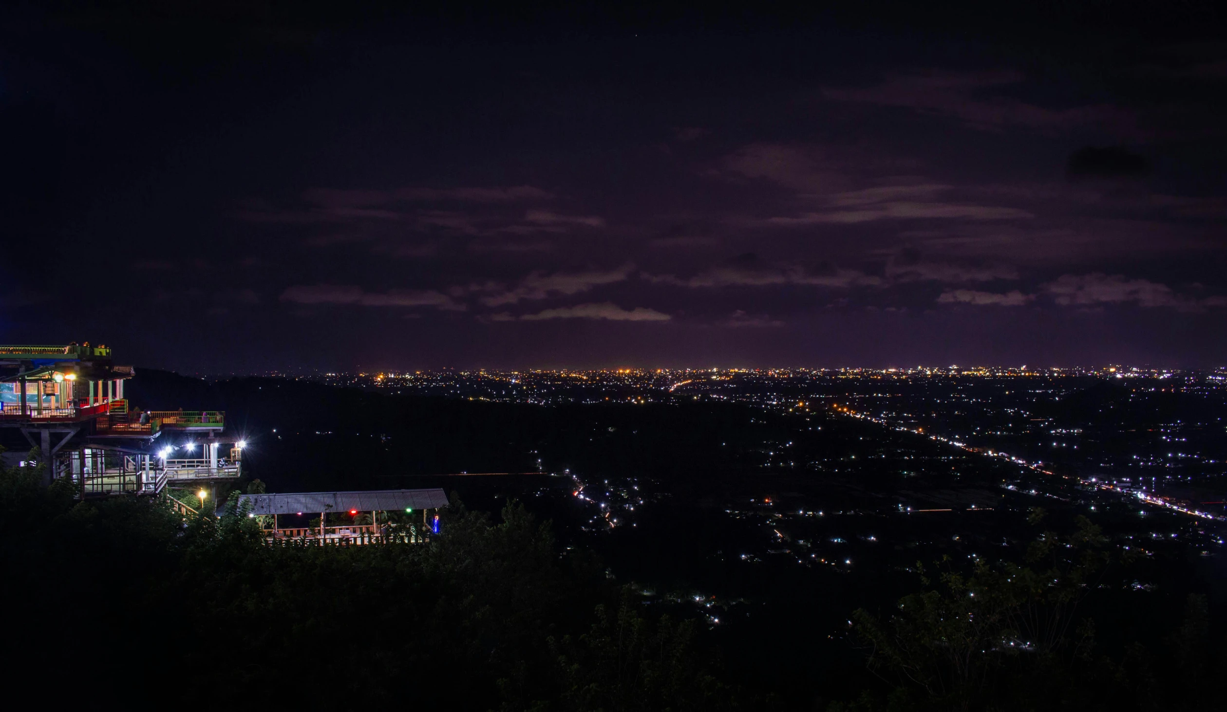 a view of a city at night from the top of a hill, stadium landscape, landscape photo, puerto rico, sydney park