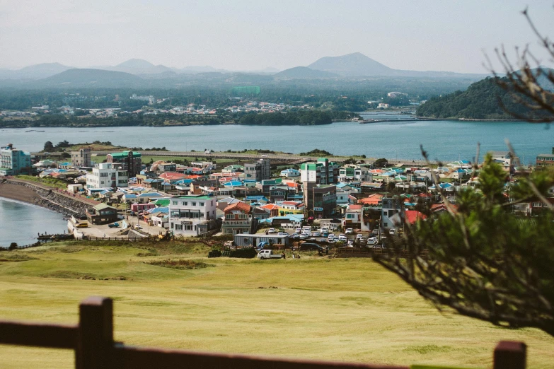 a view of a city from the top of a hill, unsplash, shin hanga, fishing village, heonhwa choe, chile, 2 0 0 0's photo