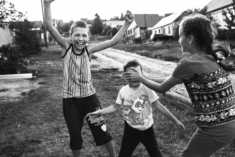 a group of young children playing a game of frisbee, a black and white photo, pexels contest winner, socialist realism, russian village, photograph of three ravers, happy feeling, ffffound