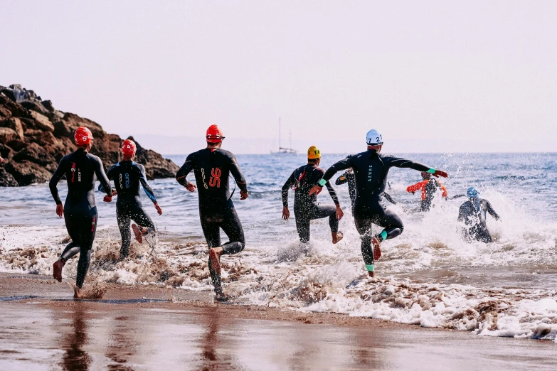 a group of people running into the ocean, skintight suits, 🚿🗝📝, profile image