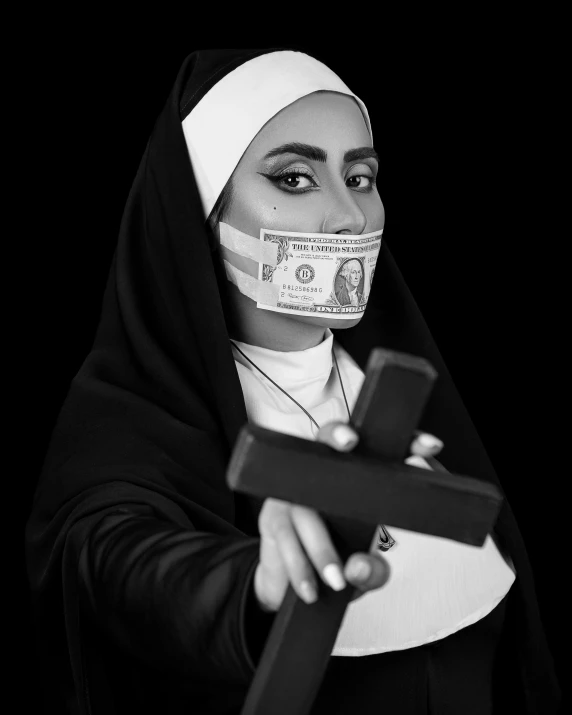 a nun holding a cross in front of her face, a black and white photo, by Hedi Xandt, pexels contest winner, feminist art, made of money, arab ameera al-taweel, bandage taped fists, drag