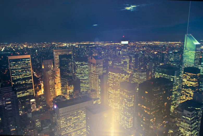 a view of a city at night from the top of a building, in style of joel meyerowitz, 8k resolution”