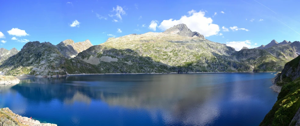 a large body of water surrounded by mountains, by Carlo Martini, pexels contest winner, hurufiyya, panoramic widescreen view, fan favorite, atlach - nacha, high quality photo