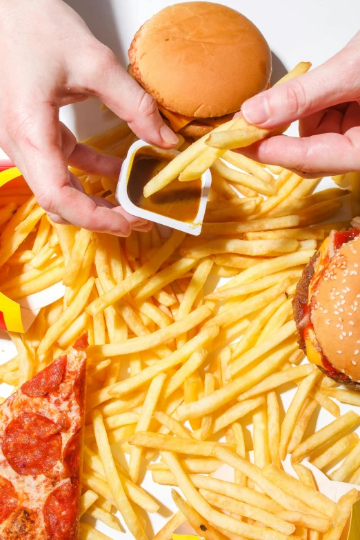 a white plate topped with french fries and a hamburger, pexels, hyperrealism, tins of food on the floor, with index finger, destructive, promo image