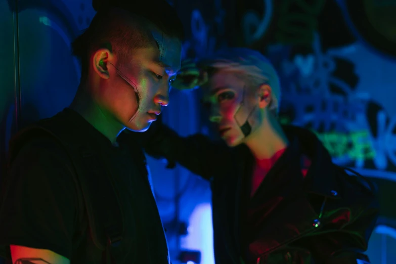 a couple of men standing next to each other, cyberpunk art, inspired by Liam Wong, pexels, synchromism, unreal engine : : rave makeup, ruan jia and arthur rackham, bisexual lighting, still frame from a movie