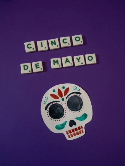 a magnet with the words cinco de mayo written on it, by Alejandro Obregón, pexels contest winner, el dia los muertos, made of all white ceramic tiles, ((purple)), may)