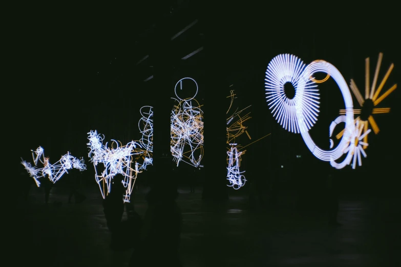 a group of people that are standing in the dark, inspired by Bruce Munro, unsplash, interactive art, whirling, glitch creatures, white lights, electricity archs