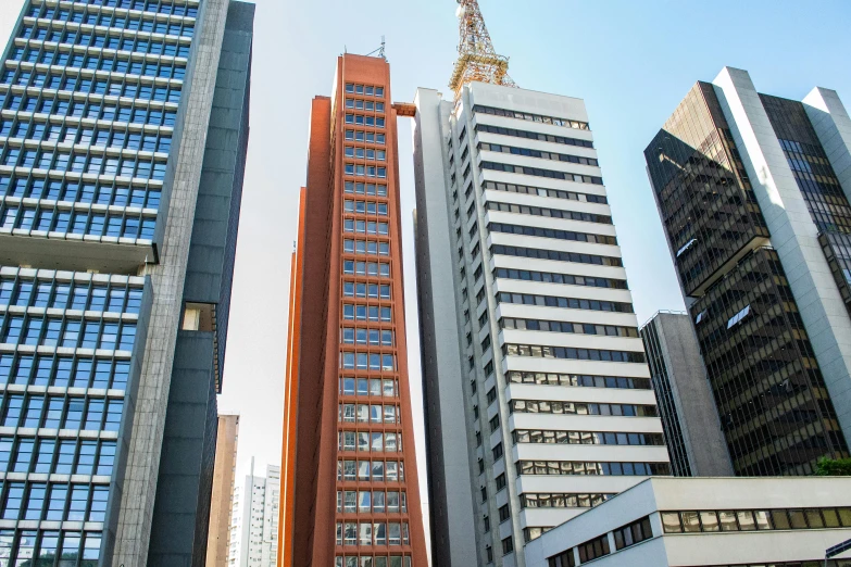 a couple of tall buildings sitting next to each other, inspired by Antônio Parreiras, pexels contest winner, modernism, são paulo, exterior view, 2000s photo, small buildings