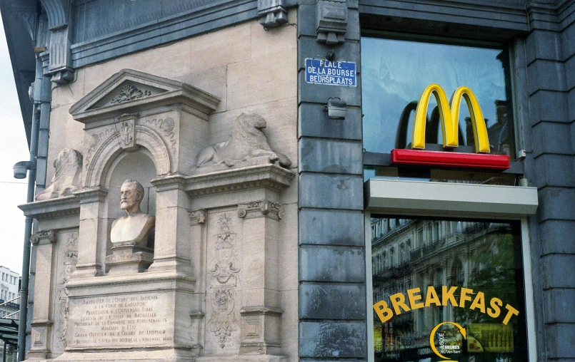 a mcdonald's restaurant with a statue in the window, a photo, by Adam Rex, neoclassicism, bouguereau and bowater, monument, 1787, fan favorite