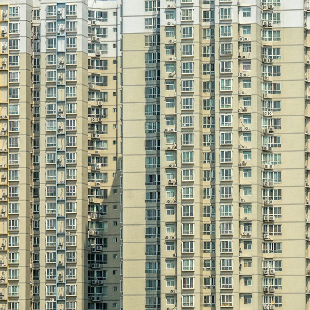 a group of tall buildings sitting next to each other, a portrait, inspired by Zhang Kechun, unsplash, hyperrealism, ten flats, golden windows, f / 1. 9 6. 8 1 mm iso 4 0, suburbia